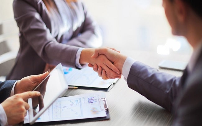 Business people shaking hands